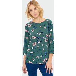 Bluzka w kwiaty. Bluzki damskie Greenpoint, bez wzorów, z poliesteru, bez kołnierzyka, bez ramiączek. Za 34.99 zł.