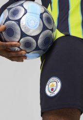 Męskie szorty Manchester City 24/25 PUMA New Navy Blue. Niebieskie szorty męskie Puma, z żakardem, bez kołnierzyka. Za 191.20 zł.