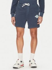 Tommy Jeans Szorty sportowe Varsity DM0DM20936 Granatowy Regular Fit. Niebieskie szorty męskie Tommy Jeans, bez wzorów, z bawełny, sportowe. Za 189.99 zł.