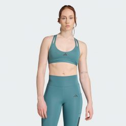 Biustonosz Aeroimpact Luxe Training Light-Support. Niebieskie biustonosze sportowe damskie Adidas, bez wzorów, z materiału. W wyprzedaży za 142.35 zł.