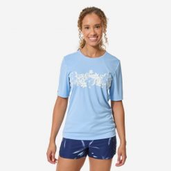 Top UV surfingowy damski Decathlon Malou Aloha krótki rękaw. Niebieskie topy sportowe damskie Decathlon, na lato, m, bez wzorów, z dzianiny, bez ramiączek. Za 49.99 zł.