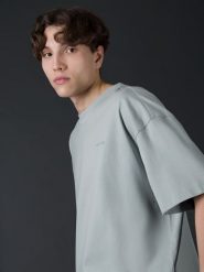 4F T-shirt oversize z bawełny organicznej męski 4F x Robert Lewandowski L. Niebieskie t-shirty męskie 4f, l, bez wzorów, z bawełny, bez kołnierzyka. W wyprzedaży za 79.99 zł.