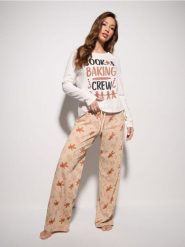 Bawełniana piżama z motywem piernikowego ludzika - biały. Białe piżamy damskie Sinsay, l, bez wzorów, z bawełny, bez ramiączek. W wyprzedaży za 29.99 zł.