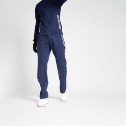 Spodnie do golfa męskie Inesis RW500 wodoodporne. Niebieskie spodnie materiałowe męskie INESIS, bez wzorów, z materiału, sportowe. Za 319.99 zł.