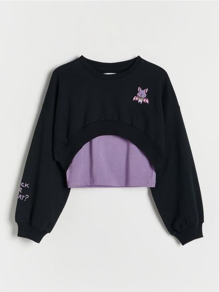 Dwuwarstwowa koszulka - czarny. Czarne koszulki dziewczęce Reserved, bez wzorów, z bawełny, bez ramiączek. W wyprzedaży za 55.99 zł.