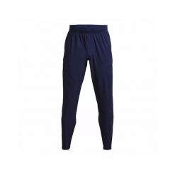 Spodnie dresowe Under Armour UA UNSTOPPABLE TAPERED PANTS. Niebieskie spodnie sportowe męskie Under Armour, z dresówki. Za 410.90 zł.