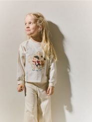 Bluza Pucio - kremowy. Białe bluzy i bluzki niemowlęce Reserved, bez wzorów, z bawełny, bez ramiączek, bez kaptura. Za 39.99 zł.