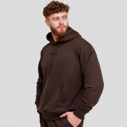 Bluza męska fitness z kapturem oversize brązowa Unstoppable. Brązowe bluzy sportowe męskie GYMBEAM, bez wzorów, z bawełny, sportowe, bez kołnierzyka, bez ramiączek. Za 118.90 zł.