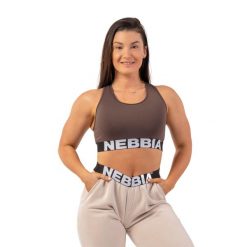 Biustonosz fitness NEBBIA Medium Impact Cross. Brązowe biustonosze sportowe damskie Nebbia, bez wzorów, z elastanu. Za 52.99 zł.
