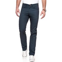 WRANGLER SPODNIE MĘSKIE ARIZONA STRETCH NAVY W12OAN114 112126291. Niebieskie spodnie materiałowe męskie Wrangler, bez wzorów, z materiału. W wyprzedaży za 89.99 zł.