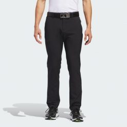 Spodnie Ultimate365 Tapered Golf. Czarne spodnie materiałowe męskie Adidas, bez wzorów, z materiału, sportowe. Za 349.00 zł.