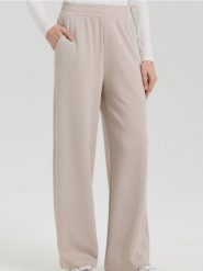 Spodnie z szeroką nogawką - beżowy. Brązowe spodnie materiałowe damskie Sinsay, bez wzorów. Za 35.99 zł.