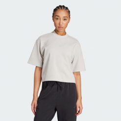Koszulka Joga Motion Waffle. Brązowe topy sportowe damskie Adidas, bez wzorów, z dzianiny, bez ramiączek. Za 179.00 zł.