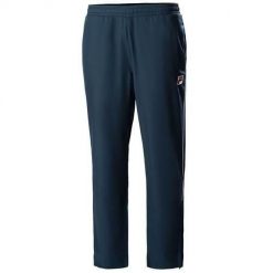 Spodnie treningowe męskie Fila FBM211006100. Niebieskie spodnie dresowe męskie Fila, na lato, bez wzorów, z dresówki. Za 322.00 zł.