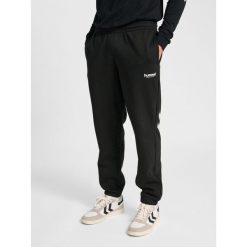 Spodnie do biegania Hummel Legacy 2.0. Czarne spodnie dresowe męskie HUMMEL, na lato, bez wzorów, z dresówki. Za 269.50 zł.