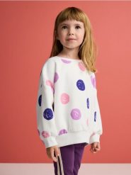 Bawełniana bluza we wzór - złamana biel. Bluzy i bluzki niemowlęce Reserved, bez wzorów, z bawełny, bez ramiączek, bez kaptura. W wyprzedaży za 27.99 zł.