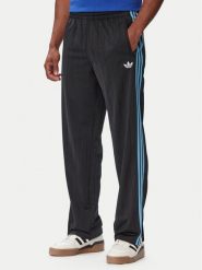 Adidas Spodnie dresowe Firebird Drop Needle KE4136 Czarny Regular Fit. Czarne spodnie dresowe męskie Adidas, bez wzorów, z dresówki. Za 329.99 zł.