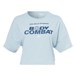 Koszulka damska Reebok Les Mills® BodyCombat® Activchill. Niebieskie bluzki sportowe damskie Reebok, m, bez wzorów, z tkaniny, bez ramiączek. Za 113.00 zł.