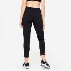 Spodnie fitness damskie Domyos krój marchewki. Czarne spodnie dresowe damskie DOMYOS, l, z elastanu, na fitness i siłownię. Za 89.99 zł.