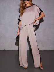 Milan Kiss Spodnie w kolorze beżowym rozmiar: XL. Brązowe spodnie materiałowe damskie Milan Kiss, bez wzorów, z materiału, z podwyższonym stanem. Za 130.99 zł.