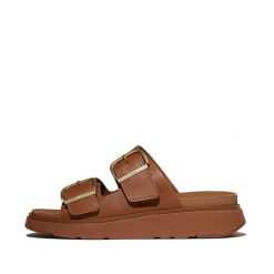 Damskie sandały na koturnie FitFlop Gen-FF. Brązowe sandały damskie FIT FLOP, bez wzorów, ze skóry, bez obcasa, na koturnie. Za 678.50 zł.