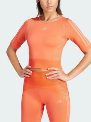Adidas Koszulka sportowa w kolorze pomarańczowym rozmiar: M. Pomarańczowe bluzki sportowe damskie Adidas, m, bez wzorów, bez ramiączek. Za 73.95 zł.