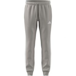 Spodnie męskie adidas Tricot Regular Tapered. Brązowe spodnie sportowe męskie Adidas, z poliesteru. Za 153.99 zł.