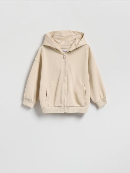 Bluza oversize z kapturem - kremowy. Białe bluzy i bluzki niemowlęce Reserved, bez wzorów, z bawełny, bez ramiączek, z kapturem. Za 49.99 zł.