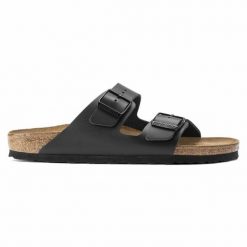 Klapki Birkenstock Arizona Nl 51193 czarne. Czarne klapki damskie bez wzorów, ze skóry, bez obcasa. Za 640.44 zł.