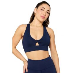 Biustonosz dla kobiet Fabletics Oasis Twist. Niebieskie biustonosze sportowe damskie FABLETICS, bez wzorów, z elastanu. Za 266.50 zł.