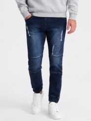 Spodnie męskie marmurkowe JOGGERY z przetarciami - ciemnoniebieskie V1 OM-PADJ-0153 - XL. Niebieskie spodnie materiałowe męskie Ombre Clothing, bez wzorów, z bawełny. W wyprzedaży za 89.99 zł.