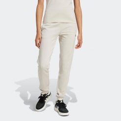 Spodnie dresowe damskie ADIDAS Gym & Pilates. Czarne spodnie dresowe damskie Adidas, s, z bawełny, na fitness i siłownię. Za 179.99 zł.