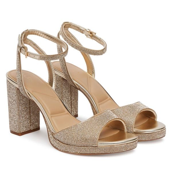 Sandały Aldo. Żółte kozaki damskie Aldo, bez wzorów, bez obcasa, na słupku. Za 509.99 zł.