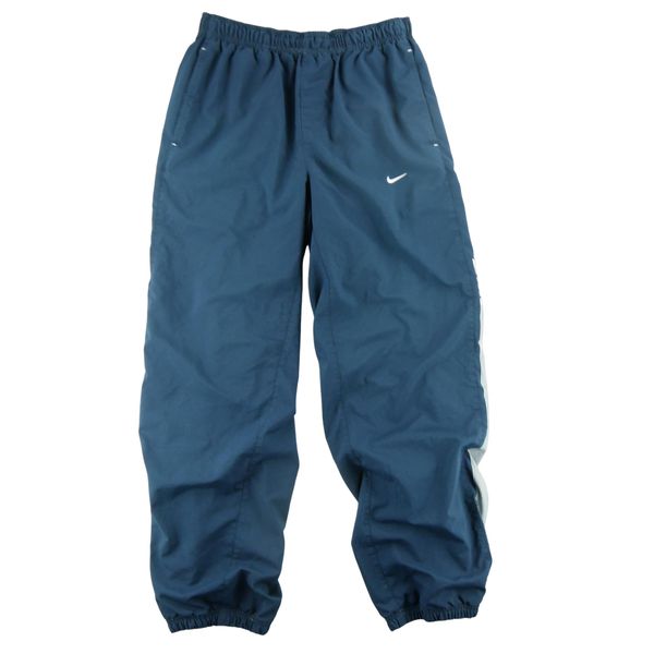 Second life - Nike Spodnie dresowe męskie - Stan dobry. Niebieskie spodnie sportowe męskie Nike, z dresówki. Za 106.46 zł.