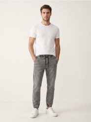 Jeansy jogger slim z efektem sprania - szary. Szare jeansy męskie Sinsay. Za 59.99 zł.