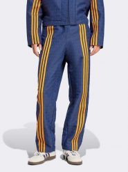 Adidas Spodnie sportowe w kolorze granatowo-pomarańczowym rozmiar: M. Niebieskie spodnie sportowe męskie Adidas. Za 223.99 zł.