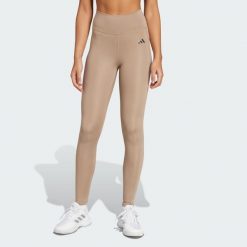 Długie legginsy Optimé Essentials Stash Pocket. Brązowe legginsy damskie Adidas, l, bez wzorów, z elastanu. Za 210.00 zł.