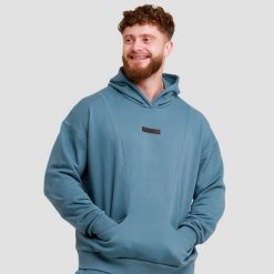 Bluza męska fitness z kapturem niebieska Unity. Niebieskie bluzy sportowe męskie GYMBEAM, bez wzorów, z bawełny, klasyczne, bez kołnierzyka, bez ramiączek. Za 122.90 zł.