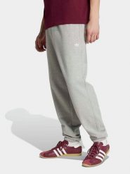Adidas Spodnie dresowe w kolorze szarym rozmiar: XL. Szare spodnie dresowe męskie Adidas, bez wzorów, z dresówki. Za 154.95 zł.