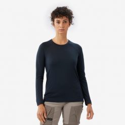 Koszulka trekkingowa damska z długim rękawem Merino Resist. Czarne bluzki damskie FORCLAZ, l, bez wzorów, z materiału, sportowe, bez kołnierzyka, bez ramiączek. Za 199.99 zł.