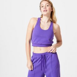 Koszulka bez rękawów damska Domyos Gym & Pilates 520 Crop. Fioletowe bluzki sportowe damskie DOMYOS, m, bez wzorów, z bawełny, bez ramiączek. Za 99.99 zł.