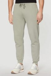 GUESS Zielone męskie spodnie Aldwin. Zielone spodnie dresowe męskie Guess, z aplikacjami, z dresówki. W wyprzedaży za 251.99 zł.