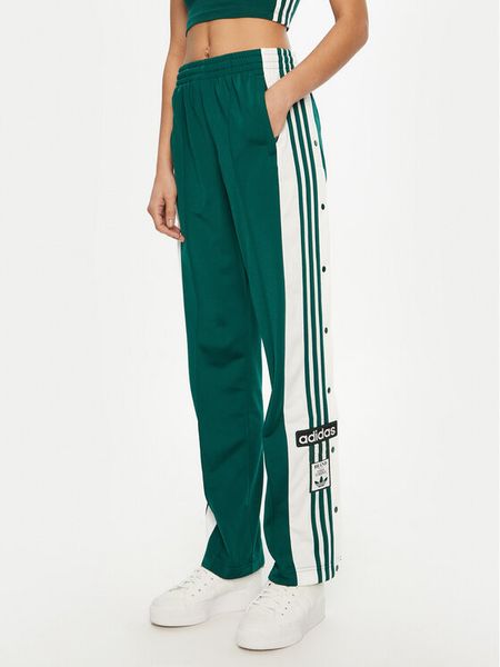 Adidas Spodnie dresowe Adibreak JD0852 Zielony Loose Fit. Zielone spodnie dresowe damskie Adidas, m, bez wzorów, z dresówki. Za 249.99 zł.