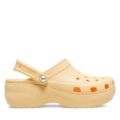 Klapki Crocs. Żółte klapki damskie Crocs, bez wzorów, bez obcasa. Za 269.99 zł.