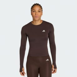 Koszulka Power Essentials Workout Contour Long Sleeve. Brązowe bluzki sportowe damskie Adidas, bez wzorów, bez kołnierzyka. Za 149.00 zł.