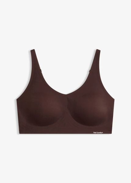Biustonosz wyściełany Feel Comfort bez fiszbinów, z wycinanym laserowo wzorem, z klejem Jellyglue 3D. Czarne biustonosze bonprix, bez wzorów. Za 84.99 zł.