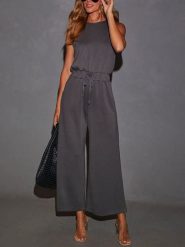 Milan Kiss Kombinezon w kolorze antracytowym rozmiar: M. Czarne kombinezony damskie Milan Kiss, m, bez wzorów, bez kołnierzyka, bez ramiączek. Za 214.70 zł.