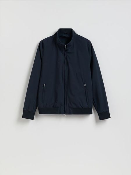 Kurtka bomberka ze stójką - granatowy. Niebieskie kurtki męskie Reserved, l, bez wzorów, bez kaptura. Za 199.99 zł.