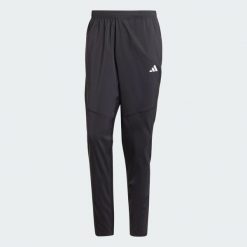 Spodnie Own The Run. Czarne spodnie sportowe męskie Adidas, z materiału. Za 259.00 zł.