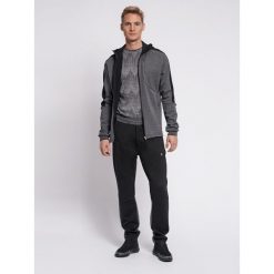 Hummel spodnie sortowe dresowe męskie Tropper Tapered Pants. Czarne spodnie dresowe męskie HUMMEL, bez wzorów, z dresówki. Za 130.00 zł.